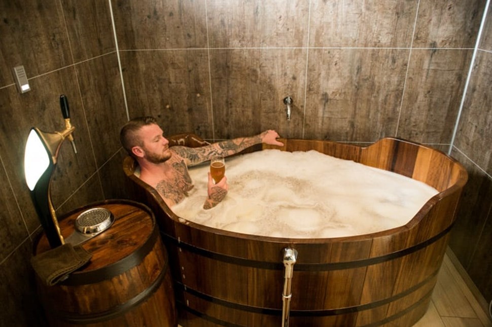 man bathe at beer spa in Iceland