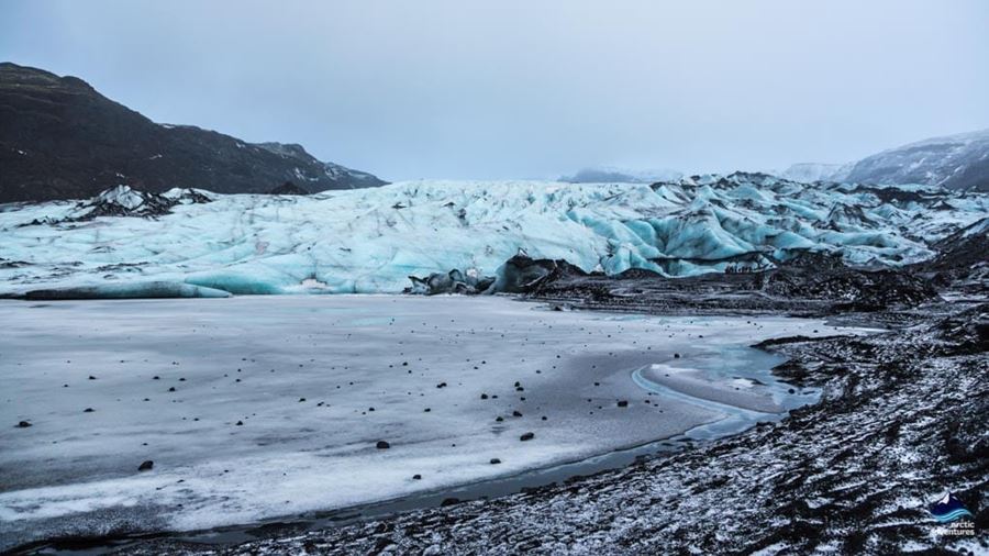 frozen Solheimajokull glacier lagoon