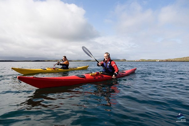 couple kayaking in arctic sea