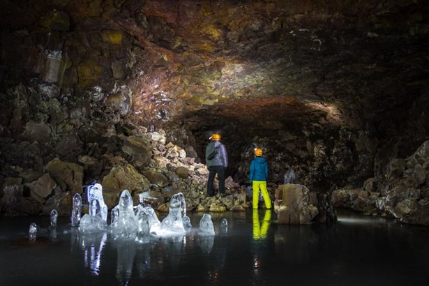 explorers inside the Lofthellir ice cave