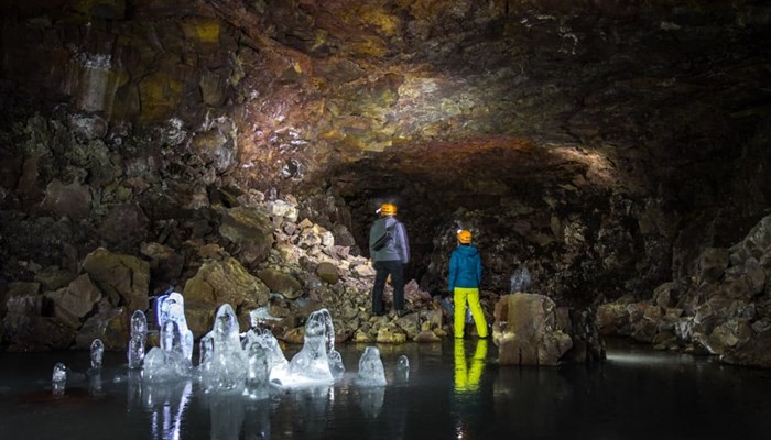 explorers inside the Lofthellir ice cave