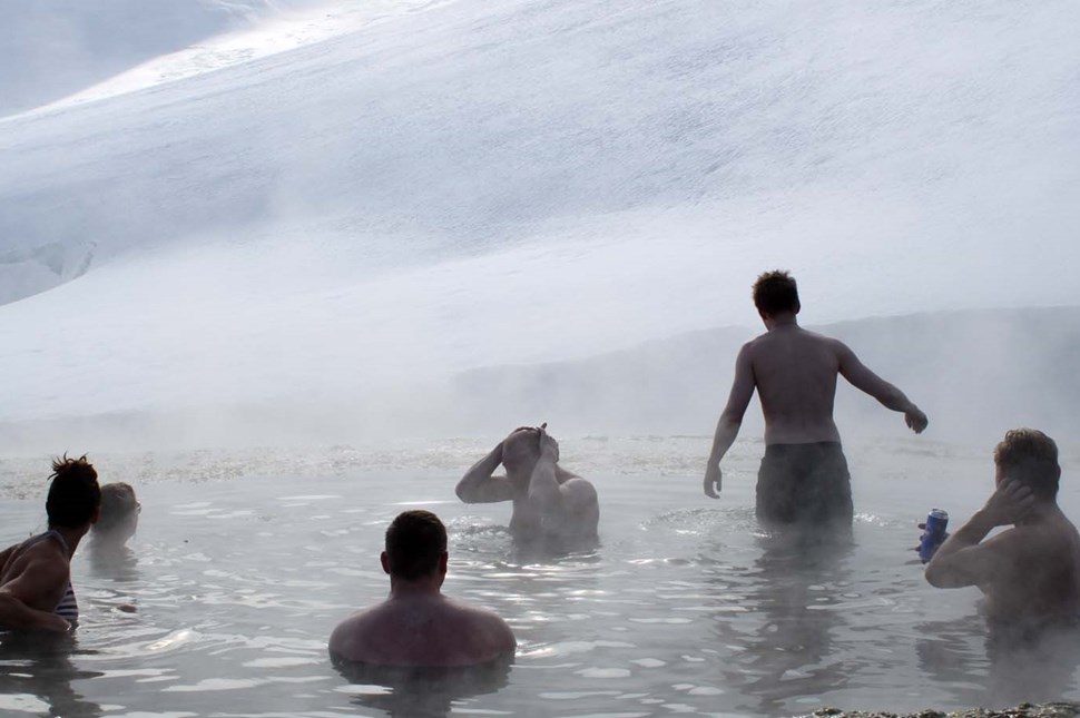people bathe in Strutslaug geothermal natural pool