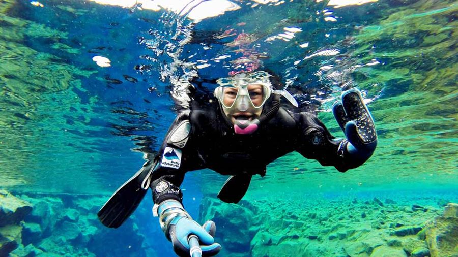 woman snorkeling in Iceland