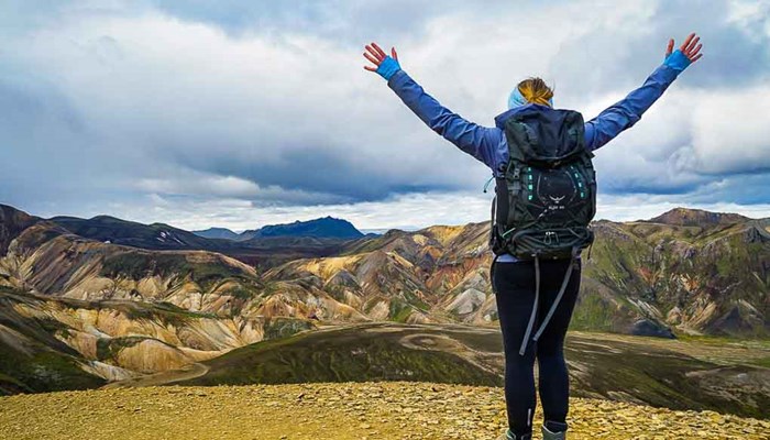 excited hiker posing for picture in landmannalaugar