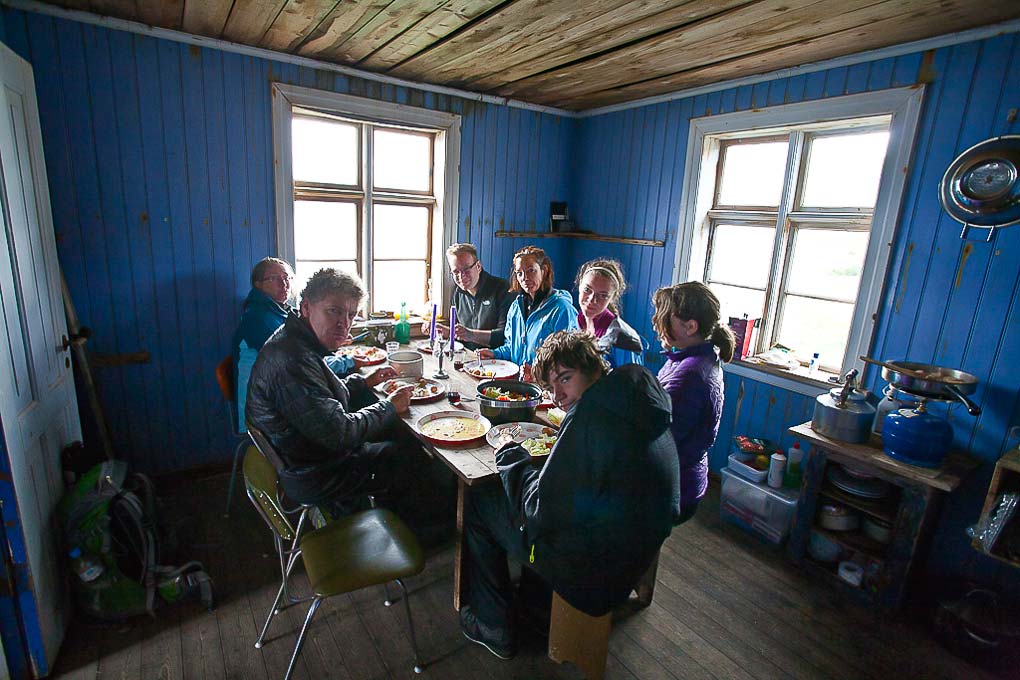 hikers having dinner in hut