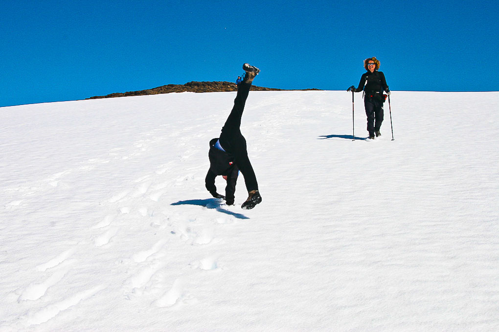 excited hikers going down the mountain
