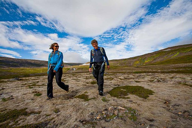 couple having hiking tour in Iceland