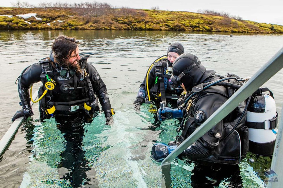 divers going under water at Silfra