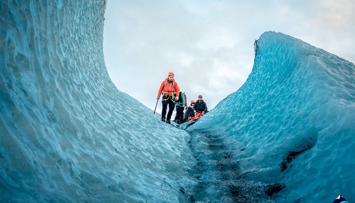people ice climbing in Sólheimajökull glacier tour
