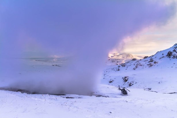 helicopter by fumarole in Iceland
