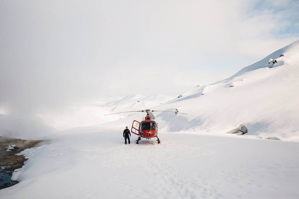 helicopter landed in snowy mountains