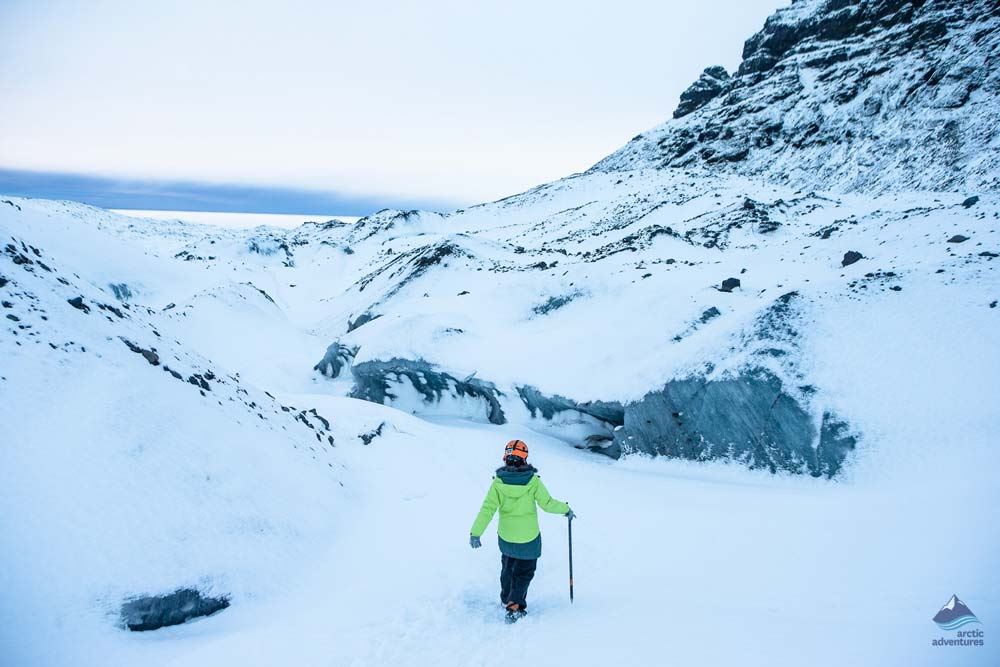 woman hiking on glacier summit