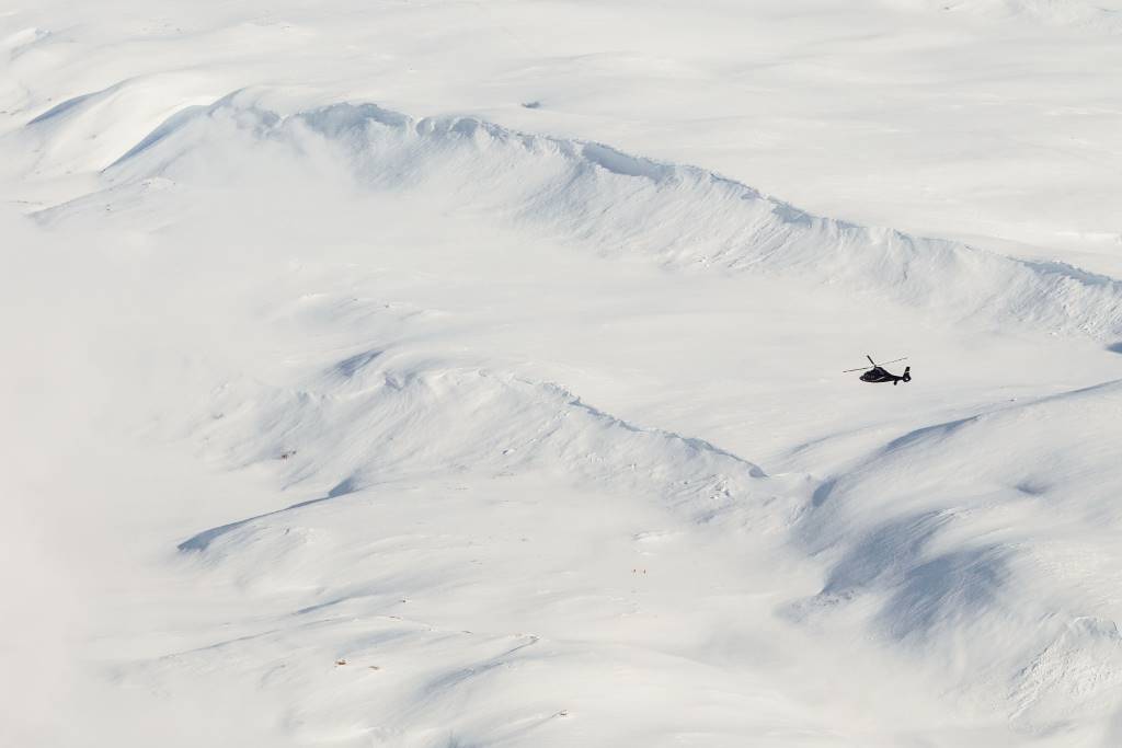helicopter over snowy fields