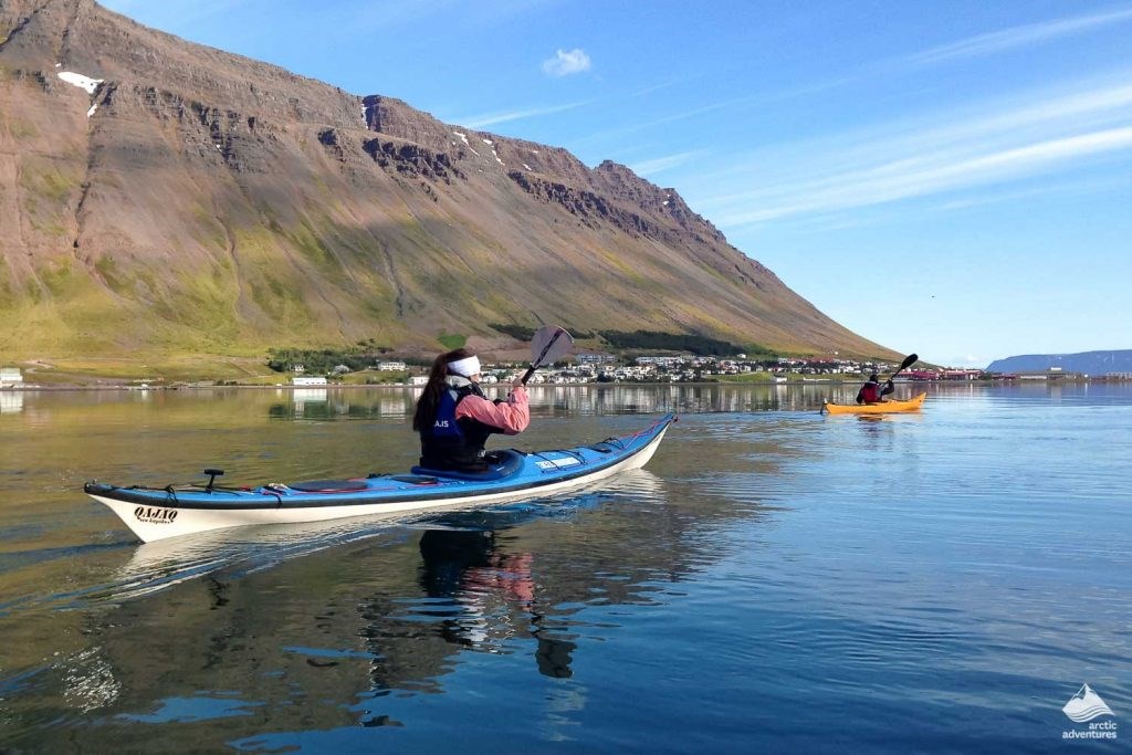 kayaking by Isafjordur city in Iceland