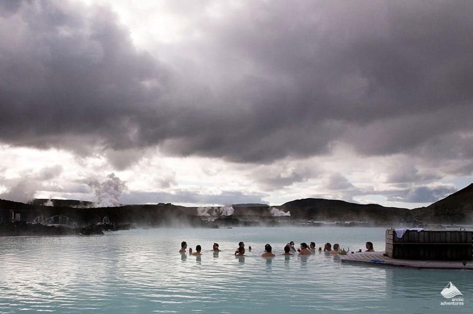 people bathing in blue lagoon in iceland