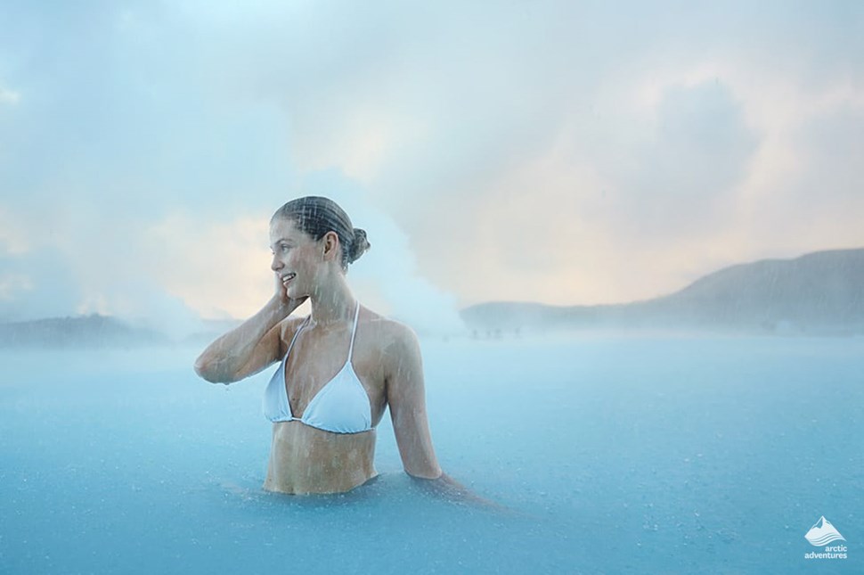 woman bathe in icelandic blue lagoon