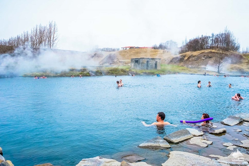 people bathe in Icelandic hot springs