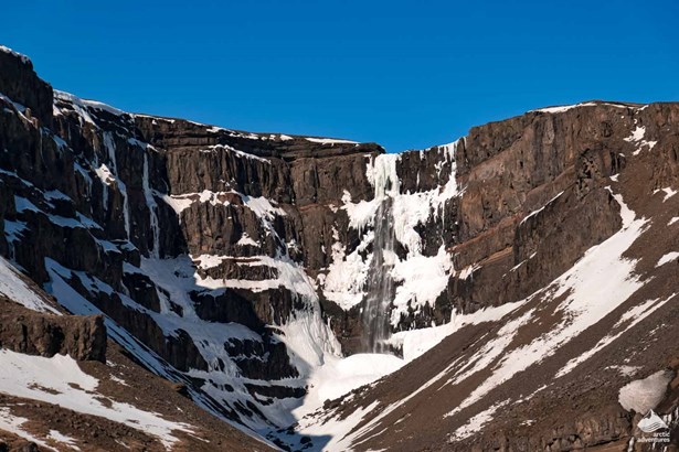 frozen Hengifoss Waterfall in winter