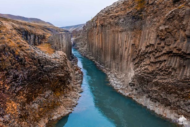 Studlagil Canyon with blue glacial water
