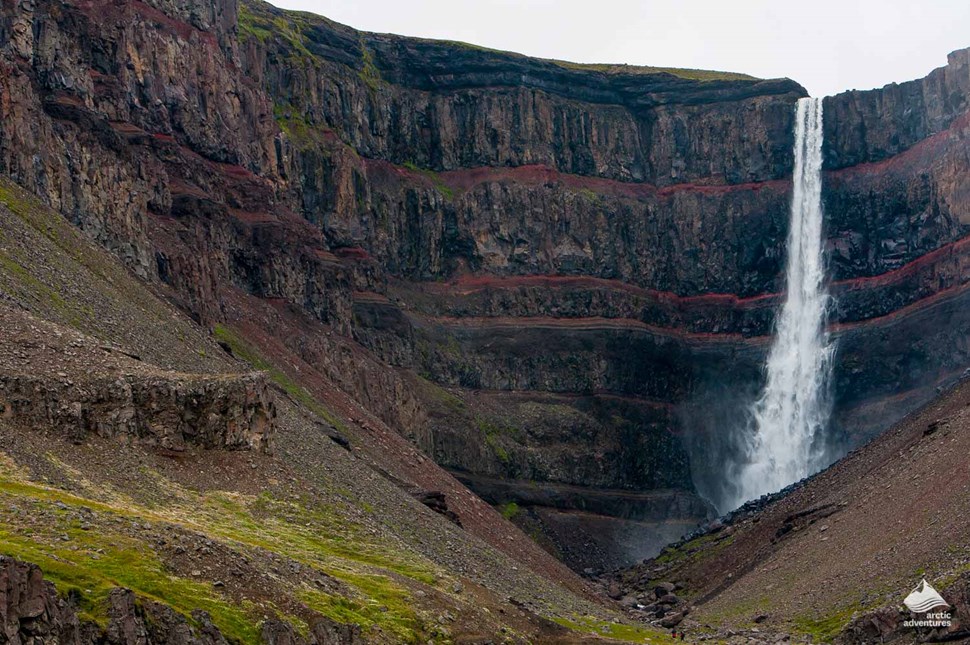distance view of Hengifoss waterfall in Iceland