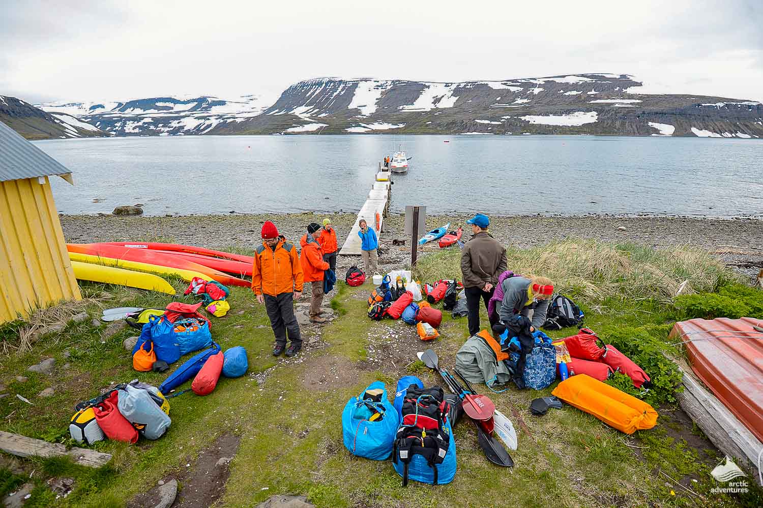people preparing equipment for kayaking in Iceland