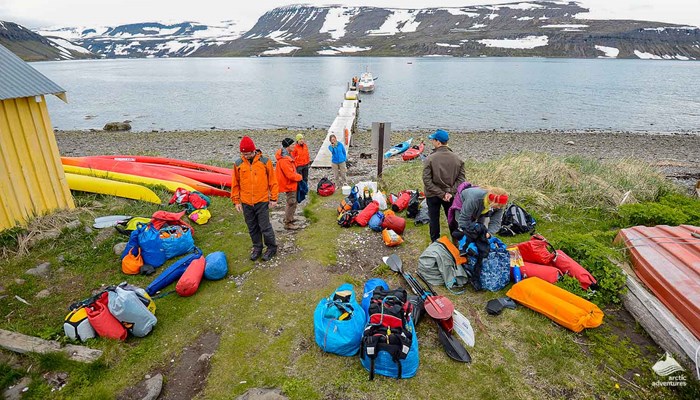 people preparing equipment for kayaking in Iceland