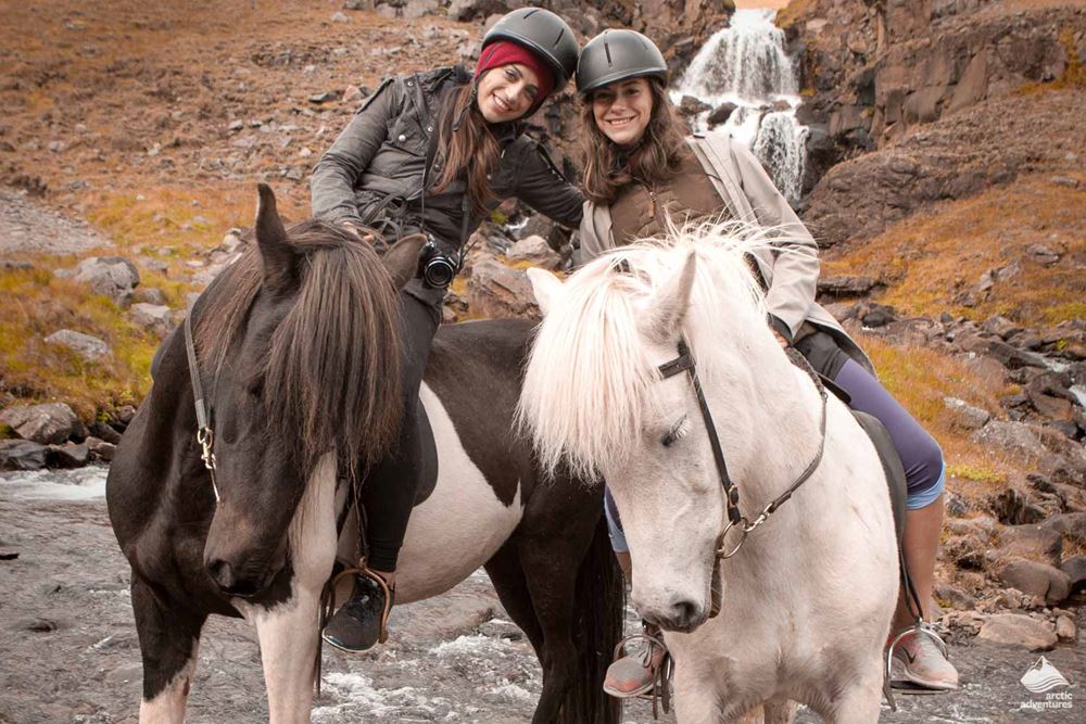 friends riding horses in Iceland