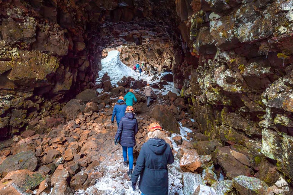 group of people walking to Raufarholshellir lava cave