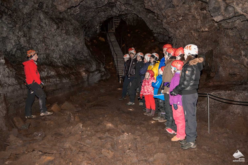 guide informs the group before lava cave tour