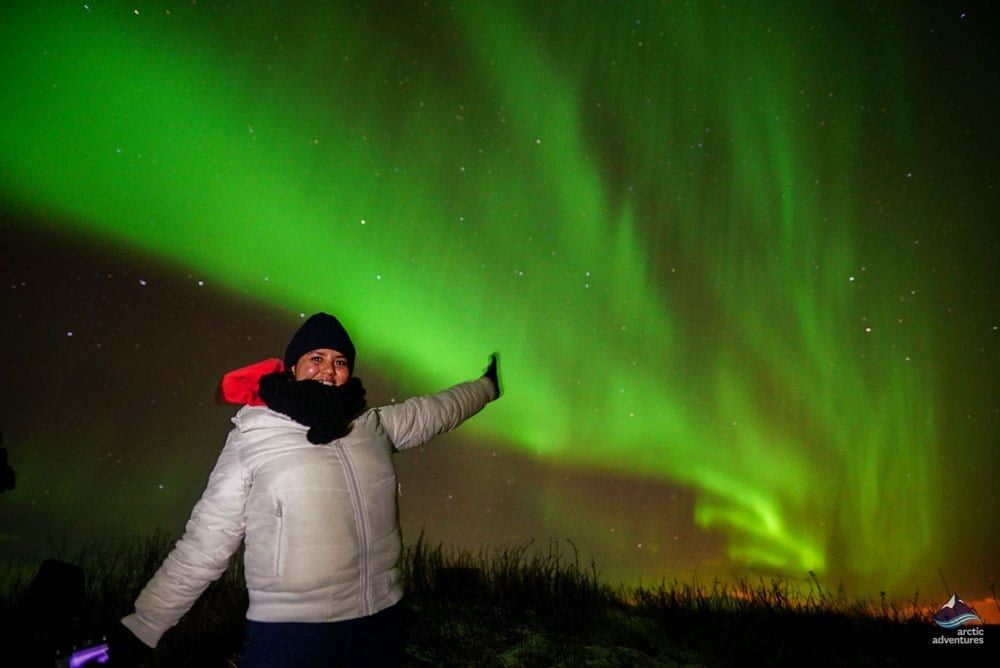 woman excited of seeing Aurora