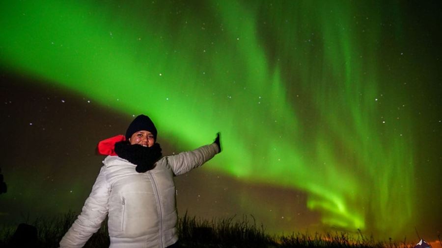 woman excited of seeing Aurora