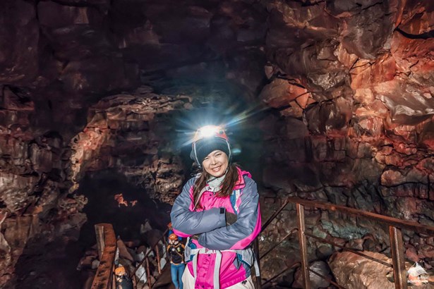 explorer standing inside Raufarholshellir Lava cave