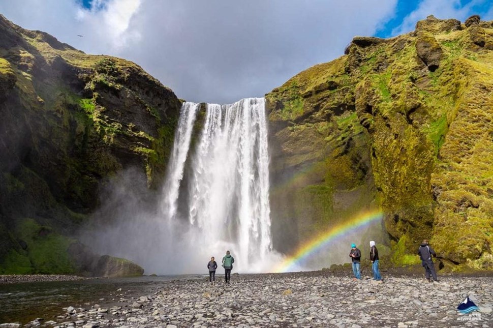 people looking at Skogafoss Waterfall in Iceland