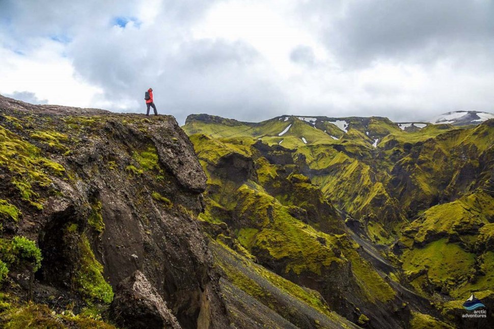 man standing on Thorsmork volcano in Iceland