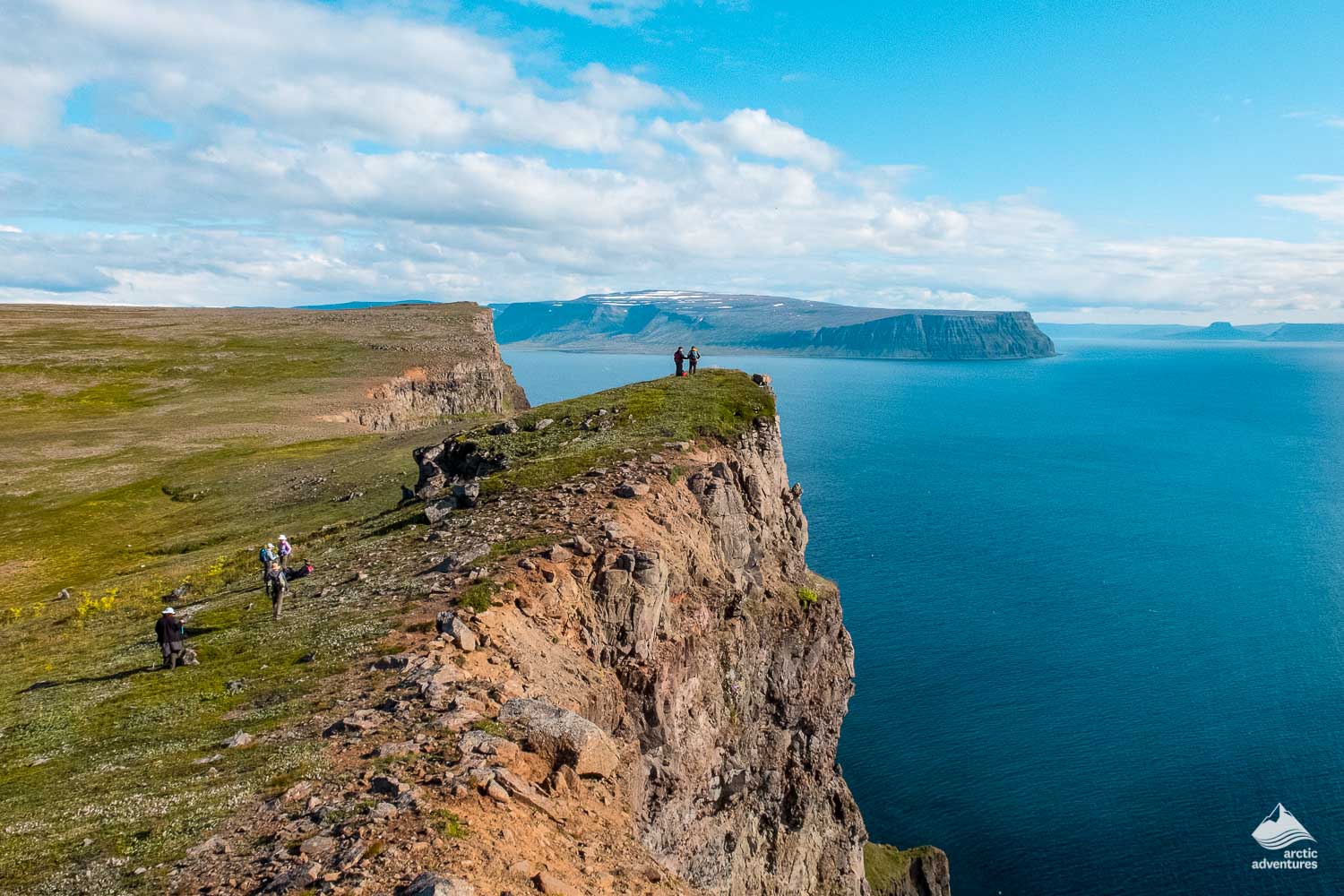 people hiking on Hornstrandir mountain in Isafjordur