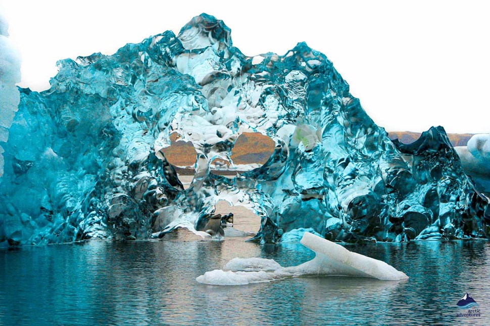clear iceberg in Jokulsarlon Glacier lagoon