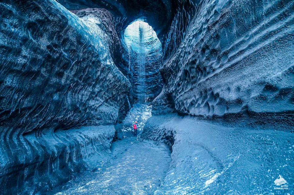 woman standing in ice cave of Katla