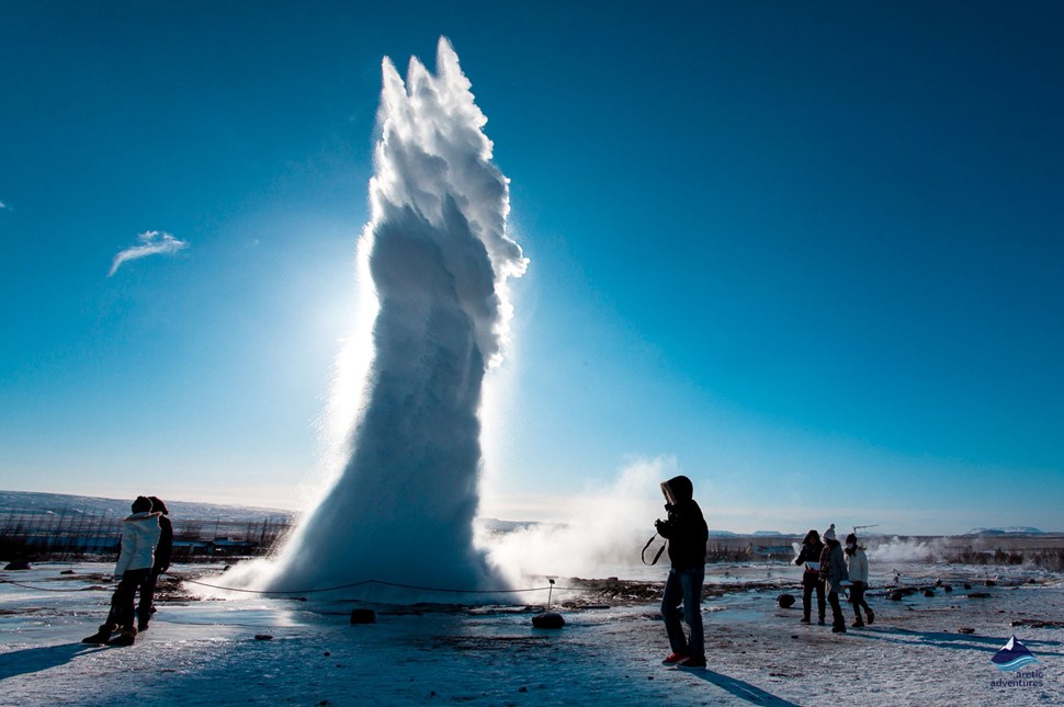 people around Strokkur Geyser eruption