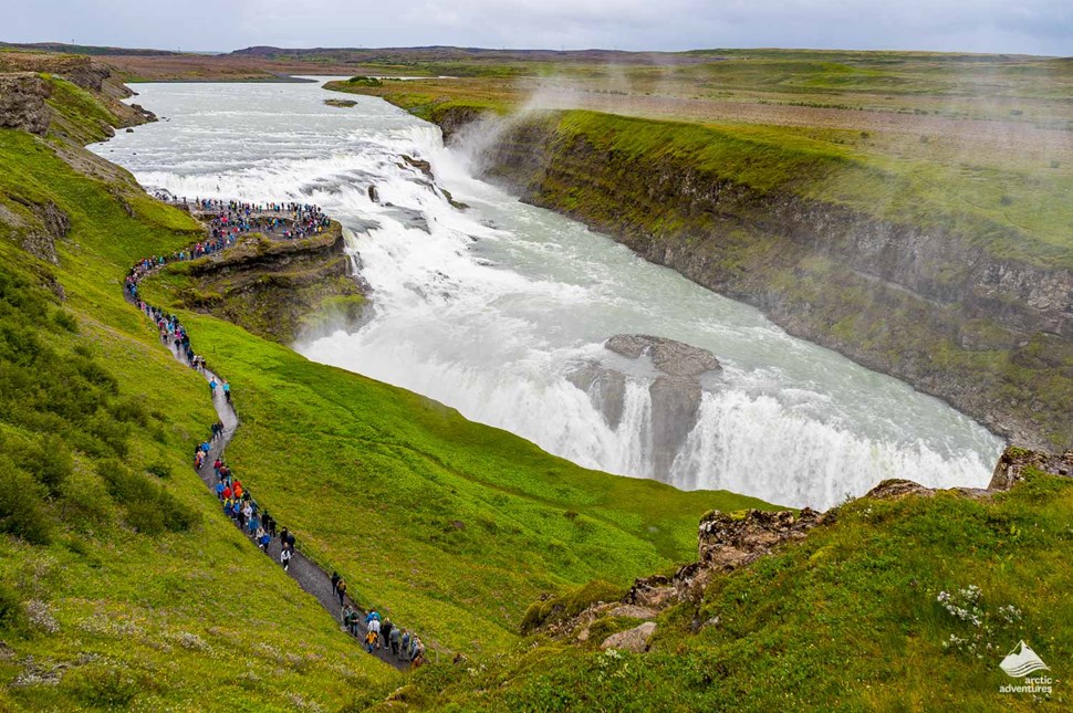 tourists visiting Gullfoss waterfall in Iceland