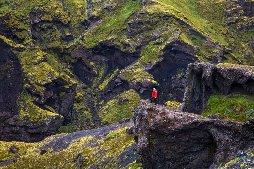 man standing on cliff at Thorsmork Volcano