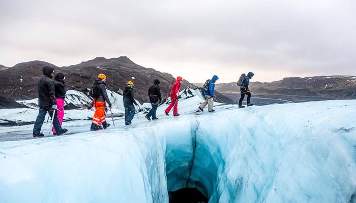 group hiking on ice at Solheimajokull Glacier