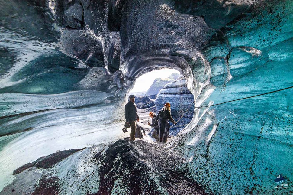 People inside Katla Ice Cave in Iceland