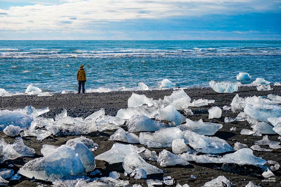Man standing on the Diamond Beach in Iceland