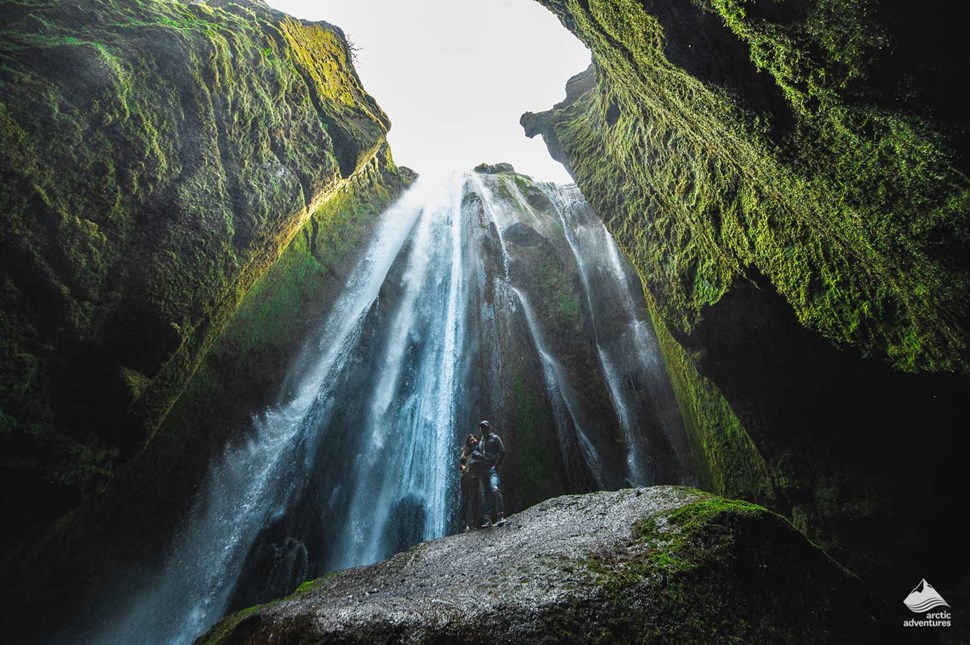 Couple near Gljufrabui Waterfall in Iceland