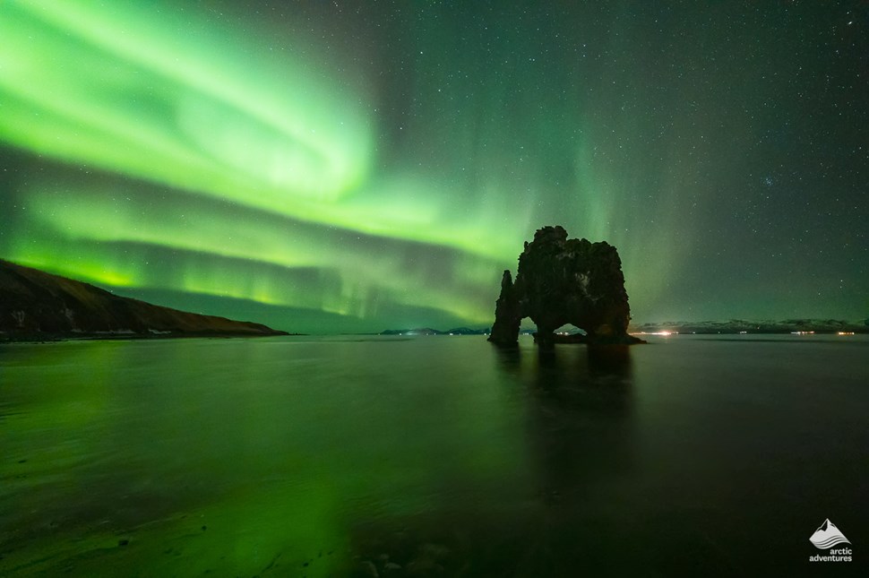 Northern Lights above Hvitserkur rhino rock in Iceland