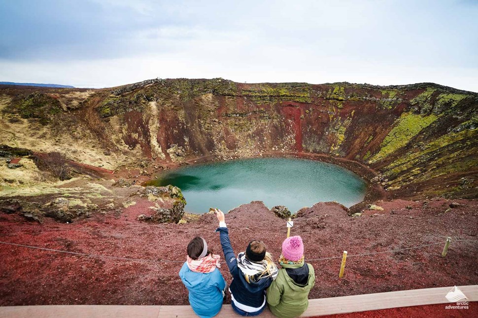 Family Looking at Kerid Crater Lake in Iceland