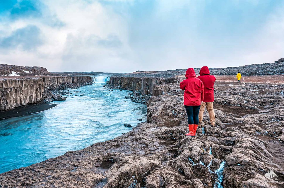Tourists looking at Selfoss Waterfall in Iceland