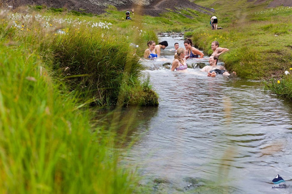 people bathe in Reykjadalur Hot Spring Thermal River