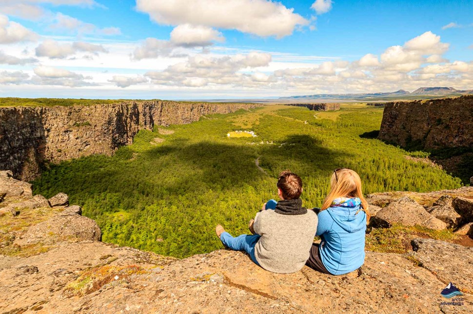 couple looking at Asbyrgi Canyon in iceland