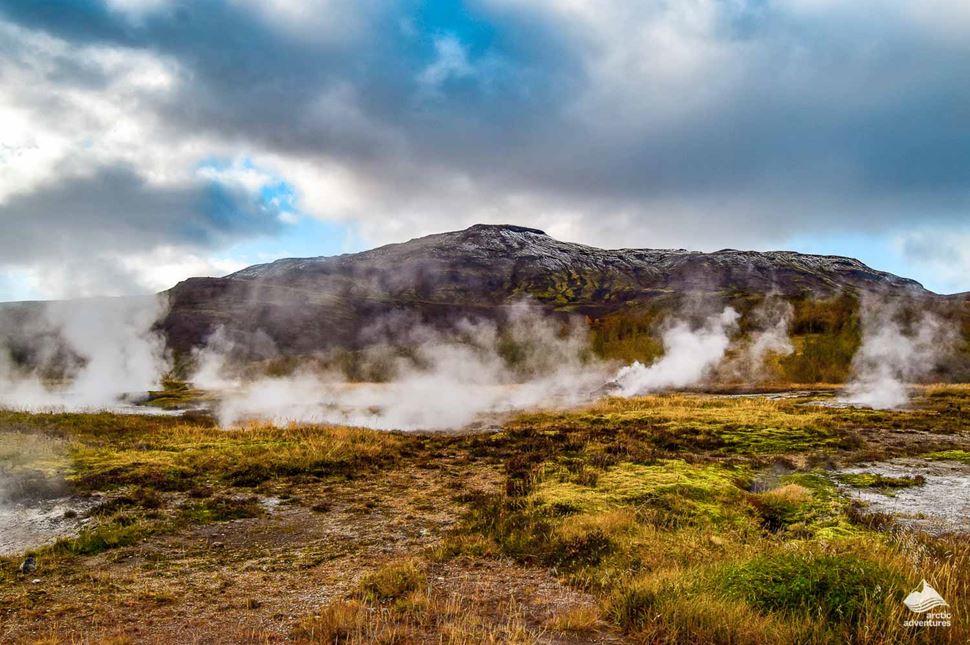 steam over the Geysir geyser in Iceland